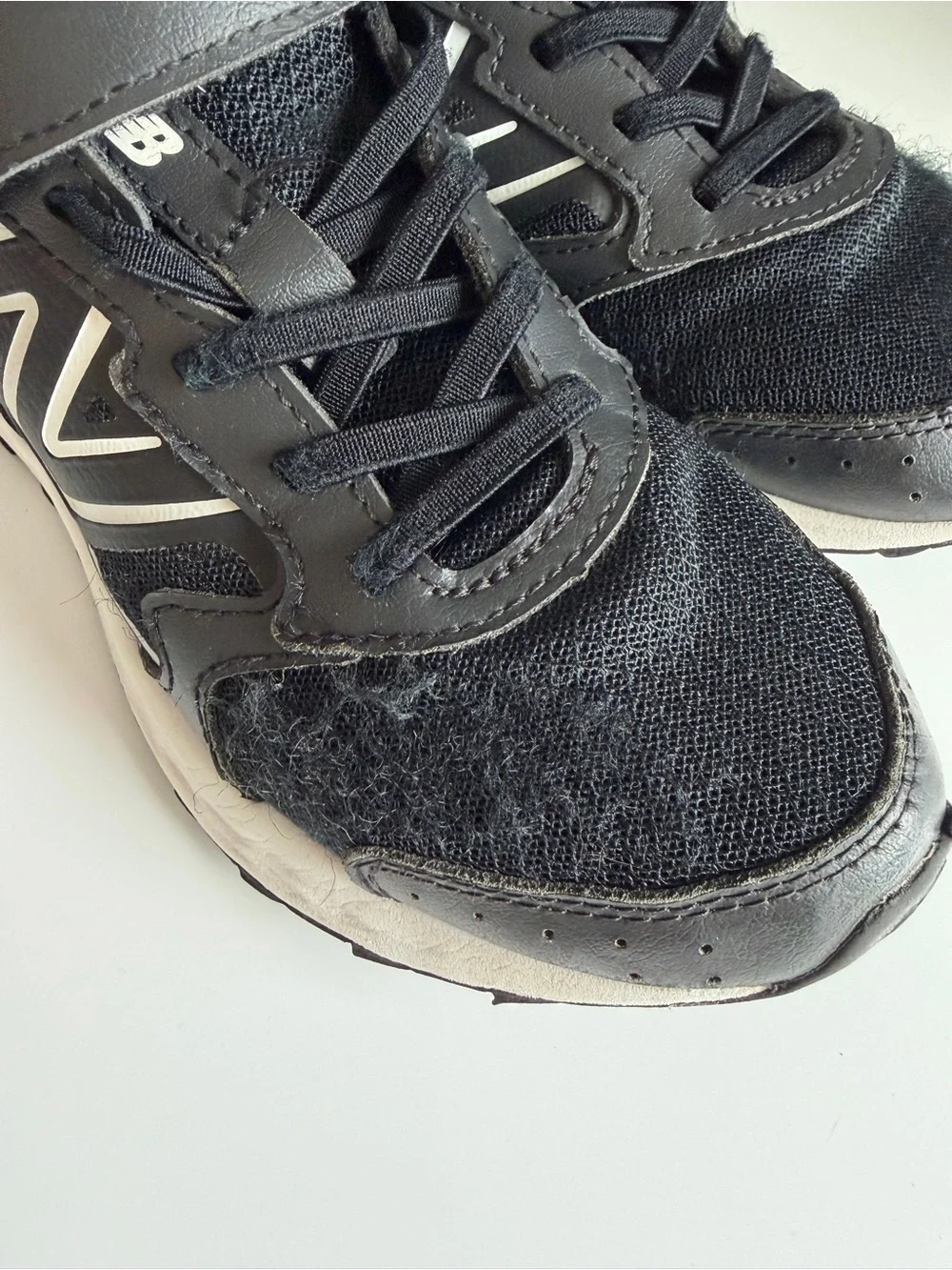 New Balance Kids Black and White Sneakers